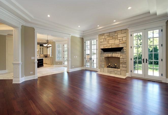 dark, hand-scraped hardwood floors in a cozy den